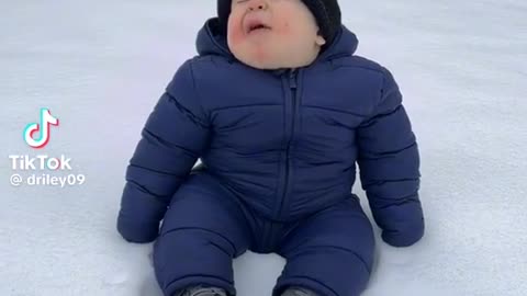 Baby talking in snow