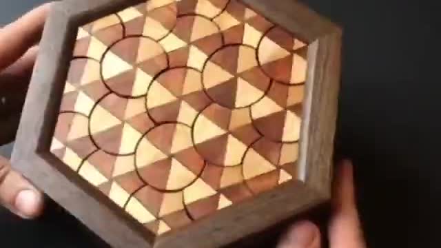 Disc Box. It takes 150 rotations to match up the triangles and open it.