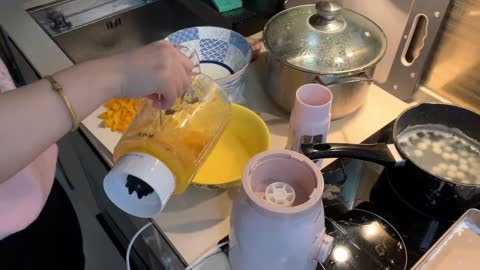 Making mango balls dessert with coconut cream