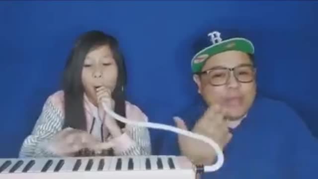 Girl plays instrument with her nose.