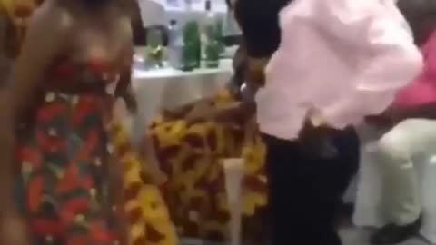 a man dancing very hard in a wedding