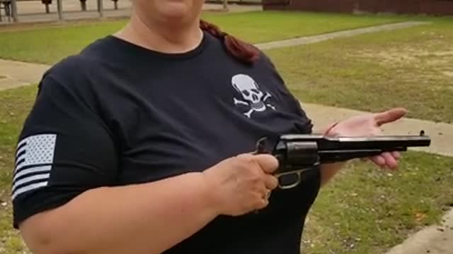 Laura shooting the Remington 1858 Gated Conversion, .45 Colt