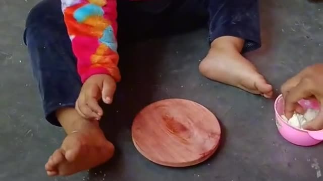 A little children make a bread.