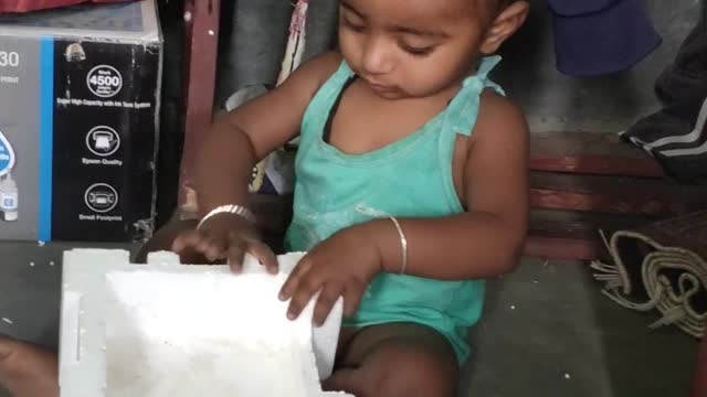 Cute baby playing video