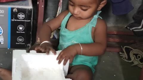 Cute baby playing video