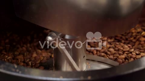 The coffee machine mixing the coffee beans inside