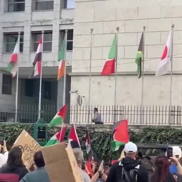 The Israeli flag is torn down in front of the United Nations building in Rome.