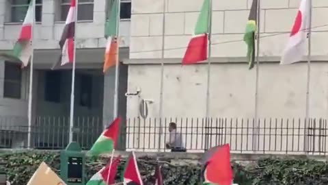 The Israeli flag is torn down in front of the United Nations building in Rome.