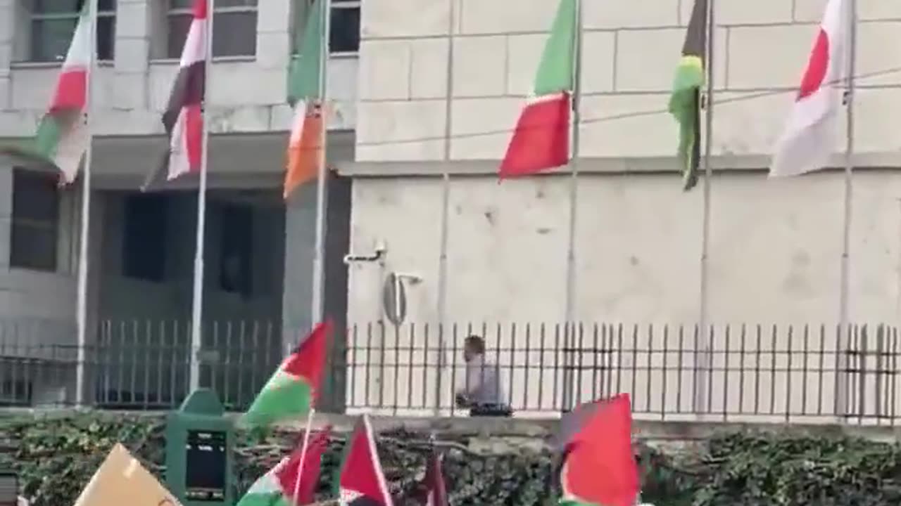 The Israeli flag is torn down in front of the United Nations building in Rome.