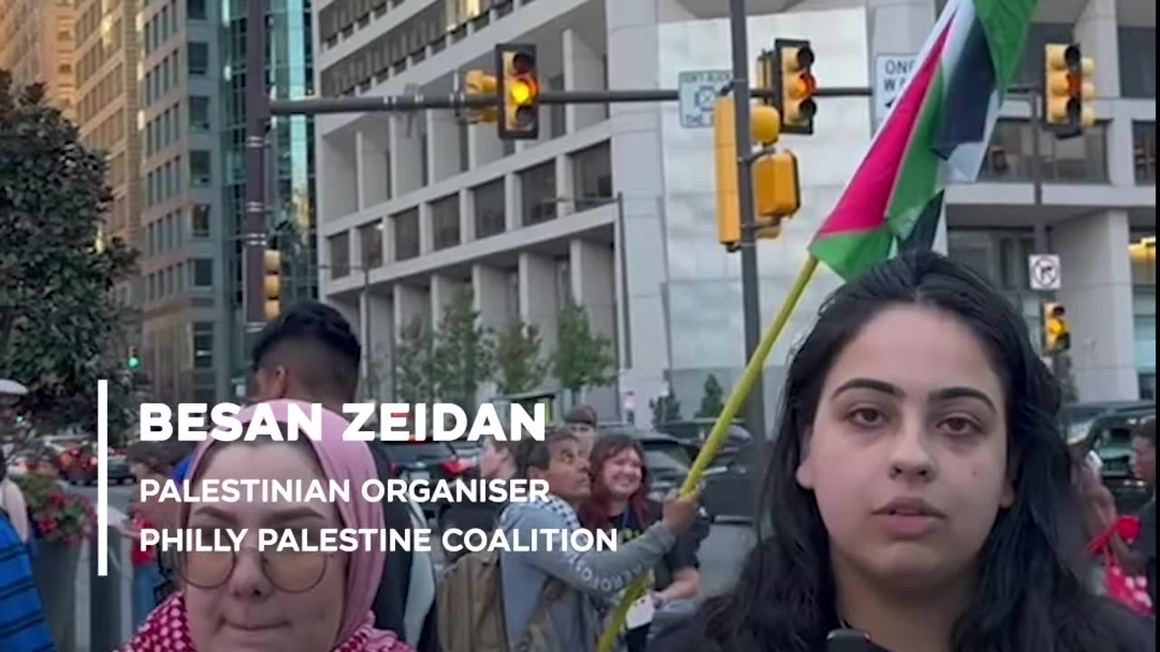 Pro-Palestinian protesters rally outside debate venue