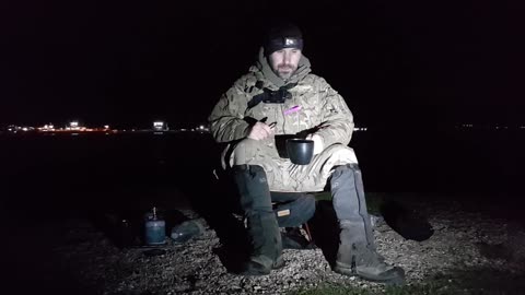 Drinking coffee and night vlog by a river .