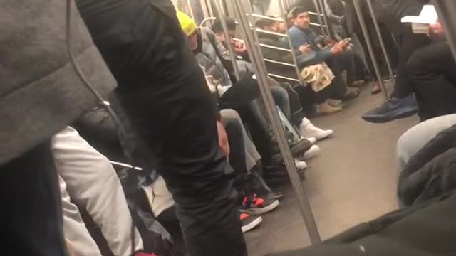 Subway performers swing on handrails and dance