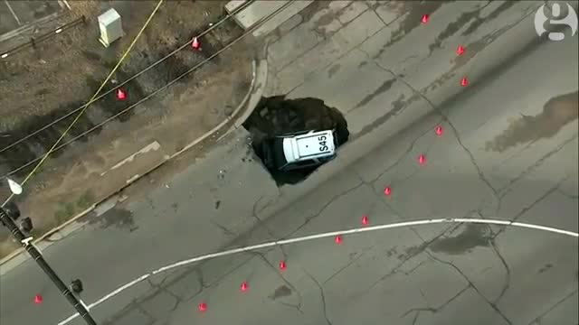 Colorado sinkhole swallows police car