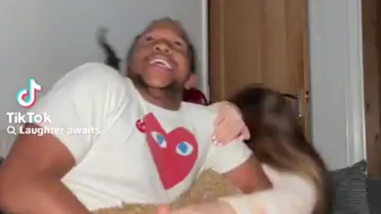 Black boyfriend tickling girlfriend feet