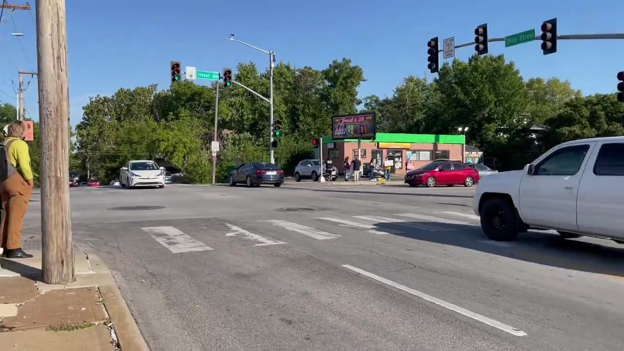 People have gathered at 39th and Troost with signs against the execution of Marcellus Williams