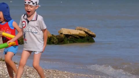 kids playing at sea