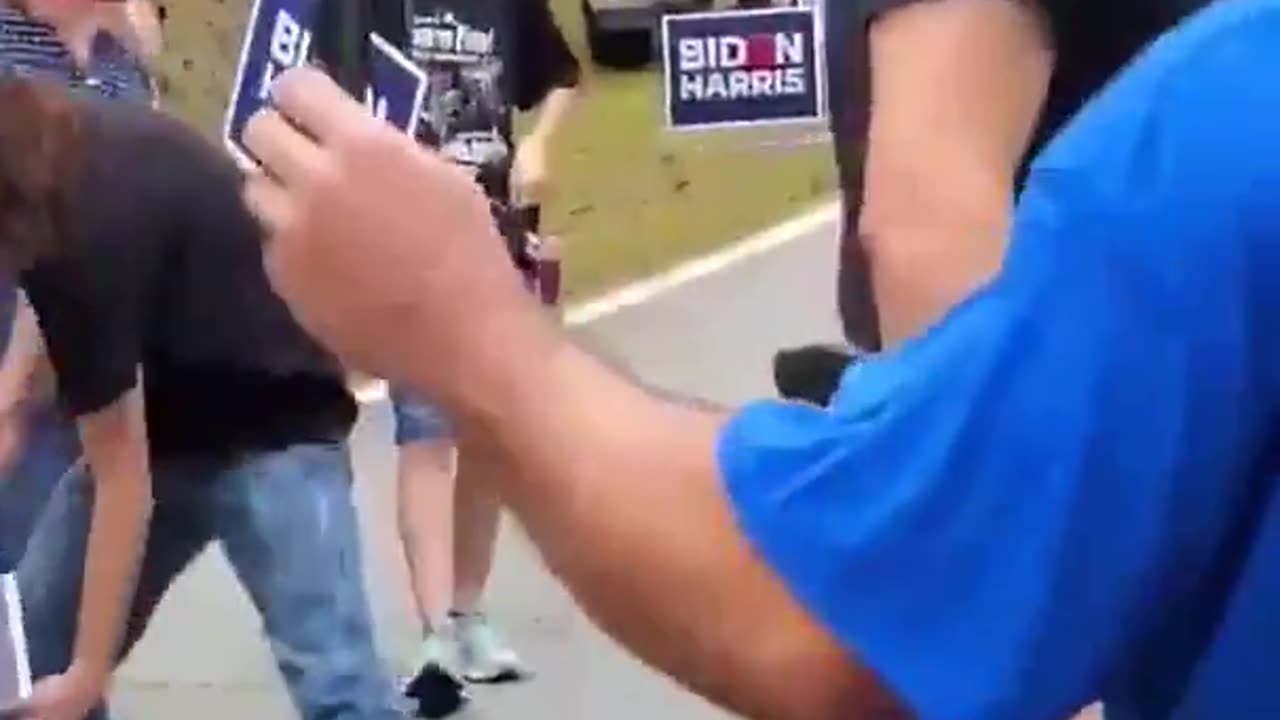 Biden/Kamala supporter gets choked after charging at Trump supporter in Warm