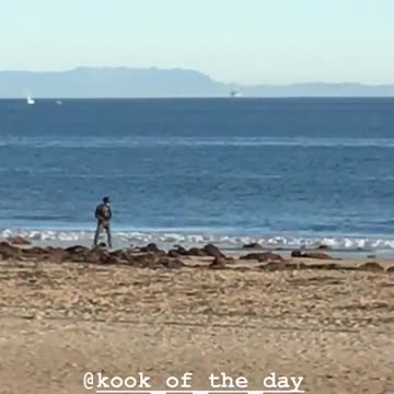 Man one wheel skateboard on beach