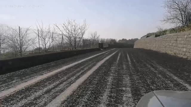 Mt. Etna eruption rains down debris all over the road