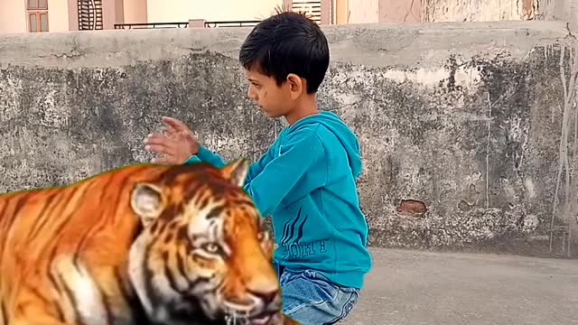 A child Shivam is playing with loin