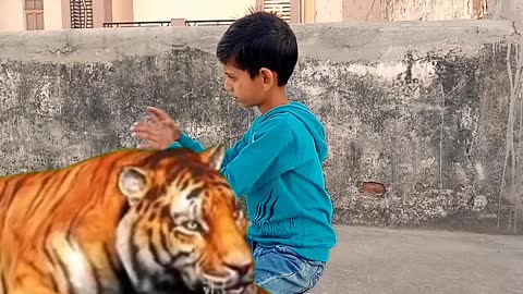 A child Shivam is playing with loin