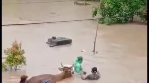 the seconds of the houses of Indonesian citizens being swept away by flash floods