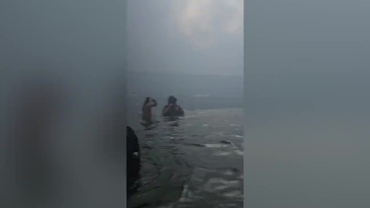 People wading in the harbor for hours escaping Maui fires