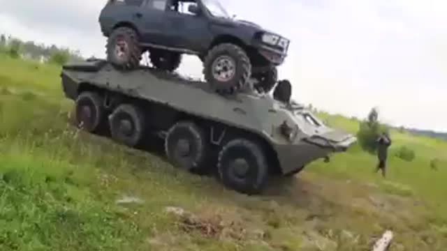 BTR carrying TOYOTA SUV through the lake