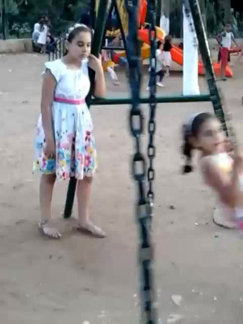 Nesrine and Aya in a playground