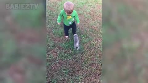 Adorable babies playing with dogs and cats.