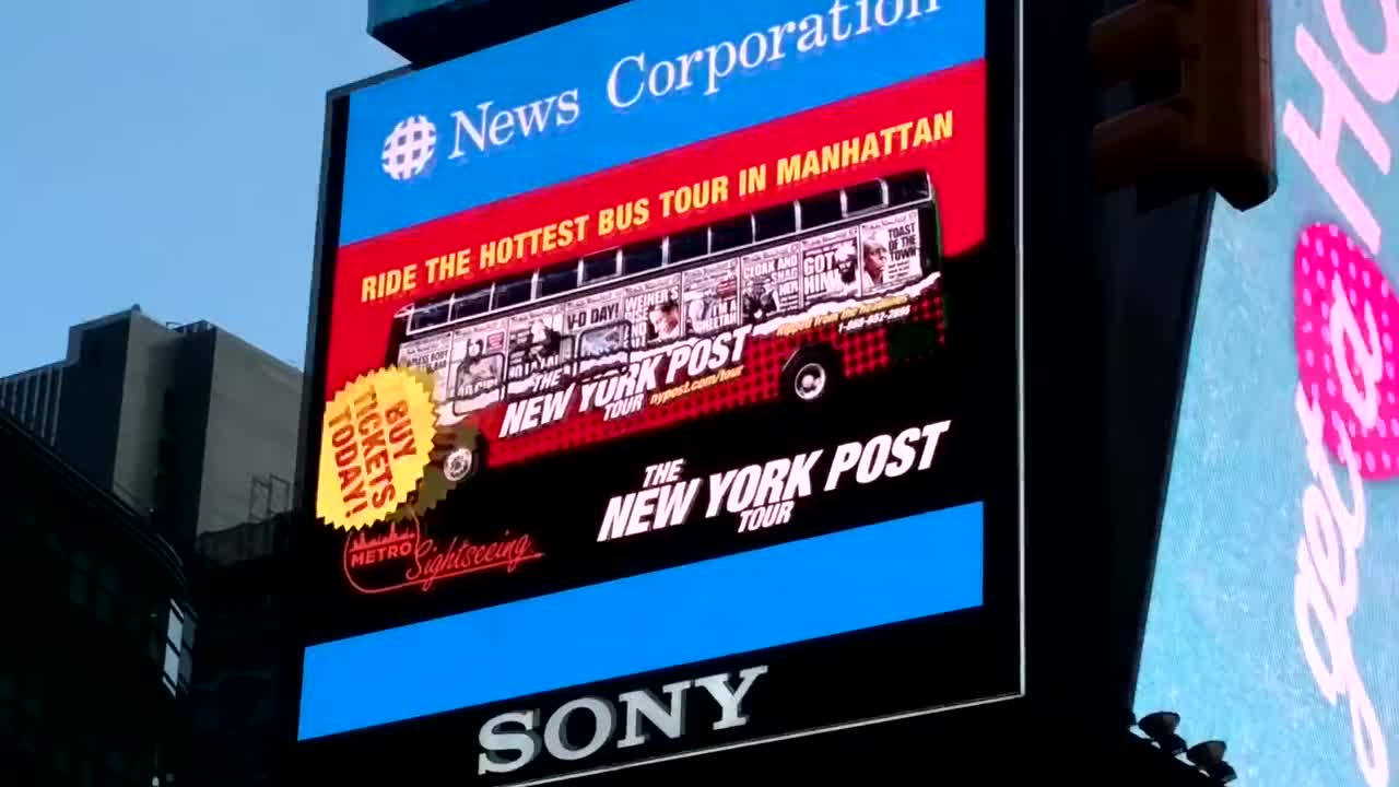 New York Post headlines tour ad at Times Square have look city