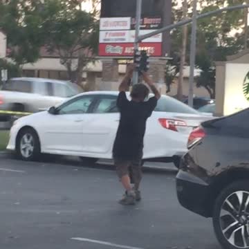 Homeless guy black shirt parking lot yoga dance