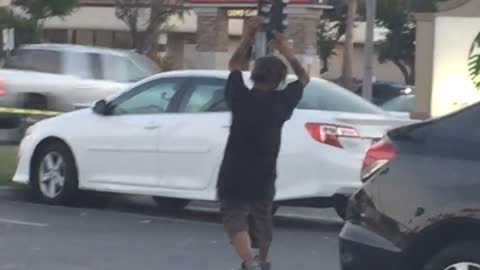 Homeless guy black shirt parking lot yoga dance