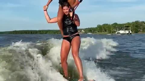 Waterskiing While Perched on Shoulders