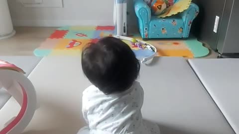 Baby dancing along TV