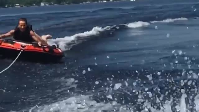 Collab copyright protection - man red tube on lake wipe out