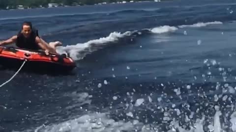 Collab copyright protection - man red tube on lake wipe out