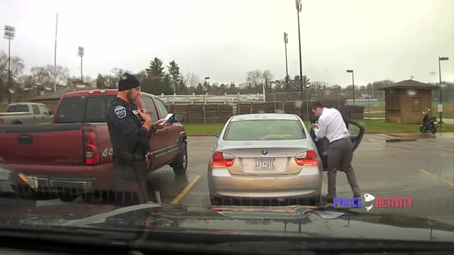 Dashcam Police Officer Helps Speeding Student Tie His Tie