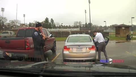 Dashcam Police Officer Helps Speeding Student Tie His Tie