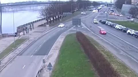 CCTV footage unoccupied car reverse on it own avoiding other cars