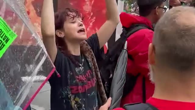 Young Demon Screaming "We Love Killing Babies" in Front of White House