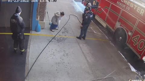 lady lifts and walks under hose for no reason