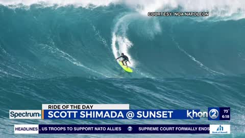 Scott is fighting through huge swell at Sunset Beach