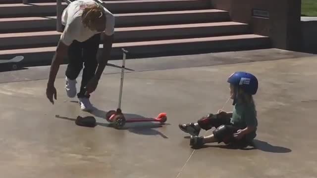 Guy skate knock down toddler scooter