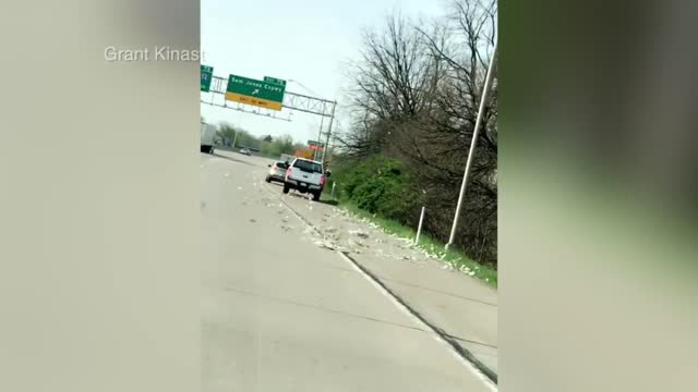 Brinks truck dumps cash on I-70