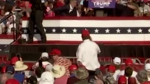 Former President Donald Trump was rushed off stage after loud bangs were heard at the start