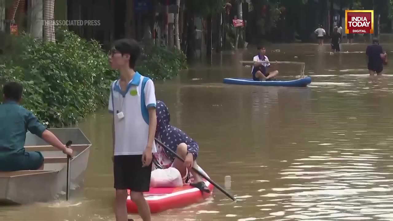 Vietnam Floods_ People In Hanoi Wade Through Flood Waters In Wake Of Typhoon Yagi