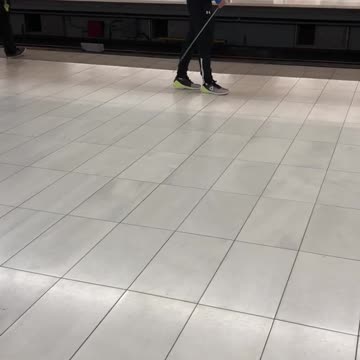 Blue jacket guy waves fencing sword around on subway terminal