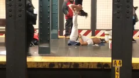 Man and woman practicing acrobatics