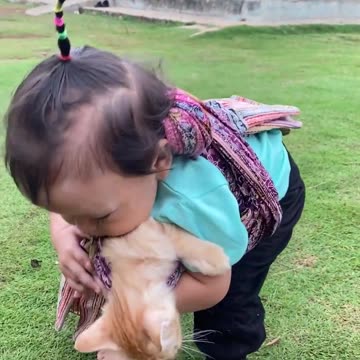 Toddler Has Unique Way Of Carrying Kitten Around
